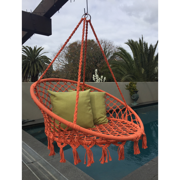 Macrame Hanging chair. Made from woven orange  cotton,