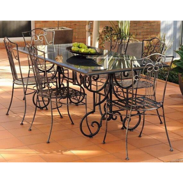 Outdoor Dining setting made from natural stone- Granite, 6 wrought iron dining chairs- Sophie  style and solid iron table base. Pictured in a courtyard, garden setting.