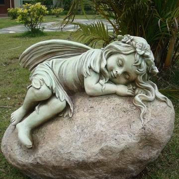 Statue - Fairy Resting on Rock in the garden