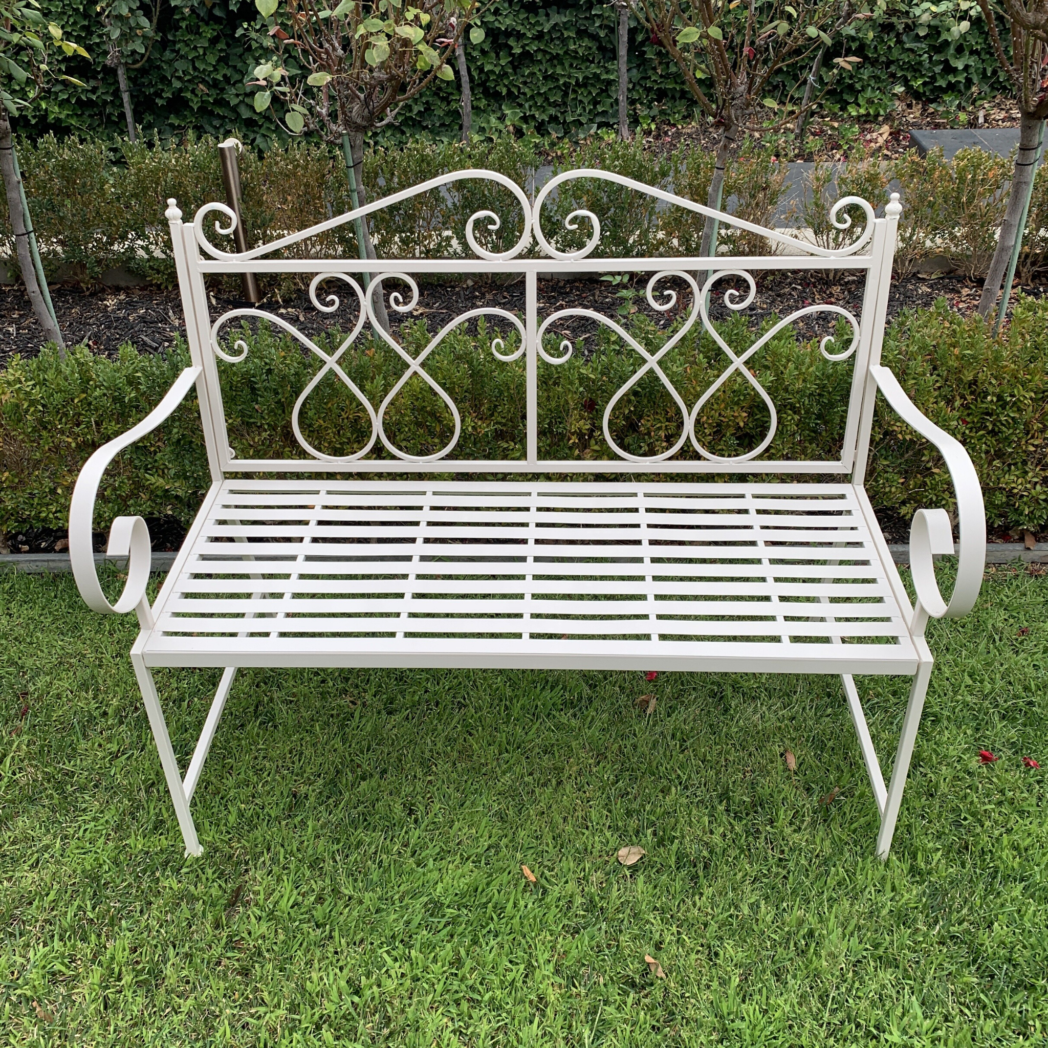 Outdoor garden bench Zara, made from metal, in cream colour, pictured in garden setting