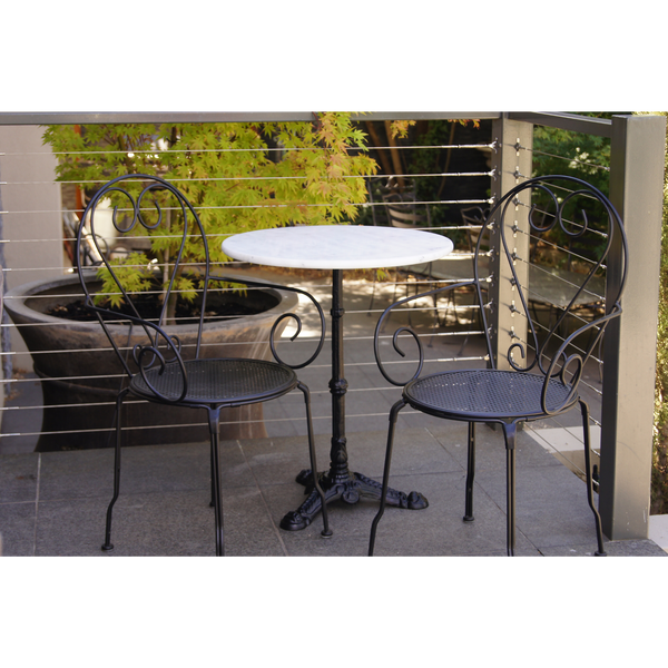 Outdoor patio setting Bella, marble top and cast iron base with 2 chairs with arms in black finish. Pictured on balcony