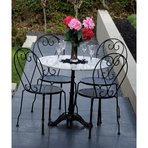 Outdoor patio setting Bella, marble top and cast iron base with 4 chairs in black. Pictured in garden setting