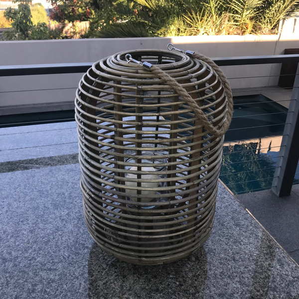 Rattan/Cane Lantern Candle Holder - Cylinder in garden
