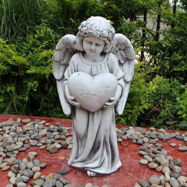 Statue - Angel Holding Heart Sculpture in the garden
